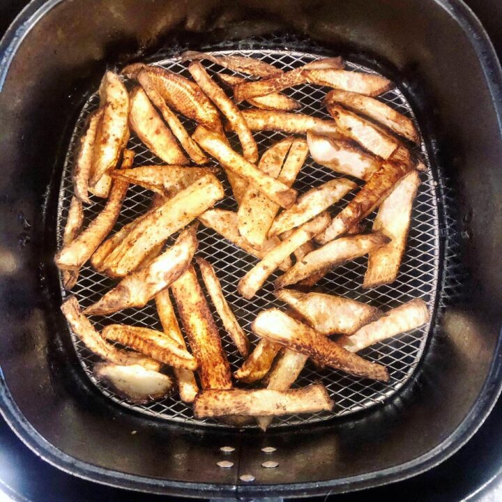 Air fryer turnip fries in the air fryer basket.