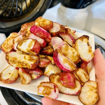 air fryer radishes served on a white plate in a ninja foodi
